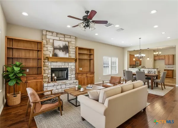 a living room with furniture and a fireplace