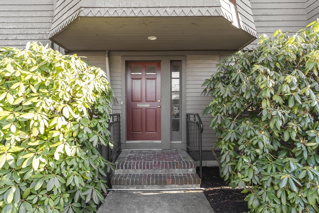 27 R West Street, Unit 8 Beverly, MA 01915 - Photo 15 of 21 a view of yellow house with a large window