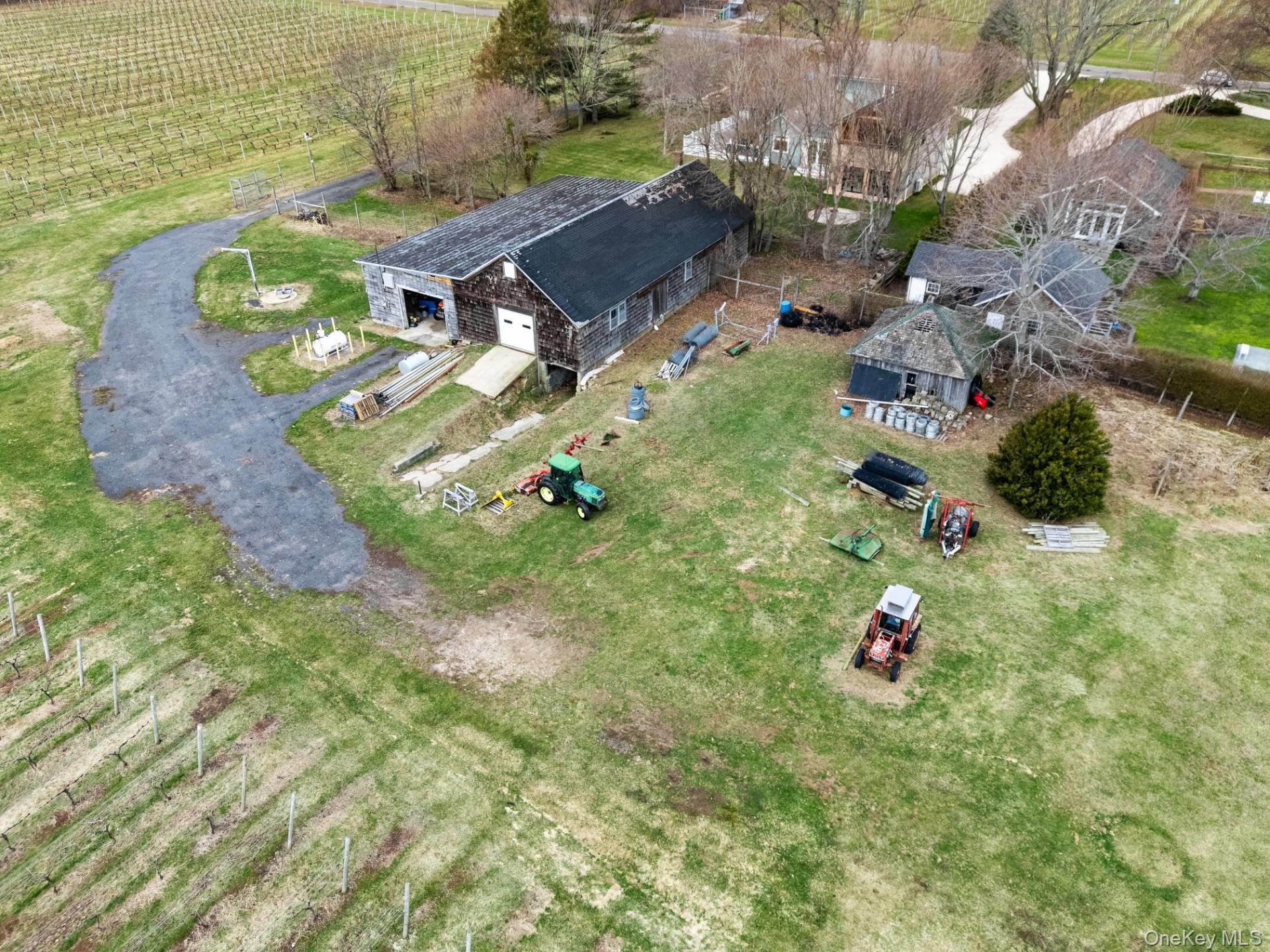 4100 Oregon Road Cutchogue, NY 11935 - Photo 16 of 17 an aerial view of a house with a yard