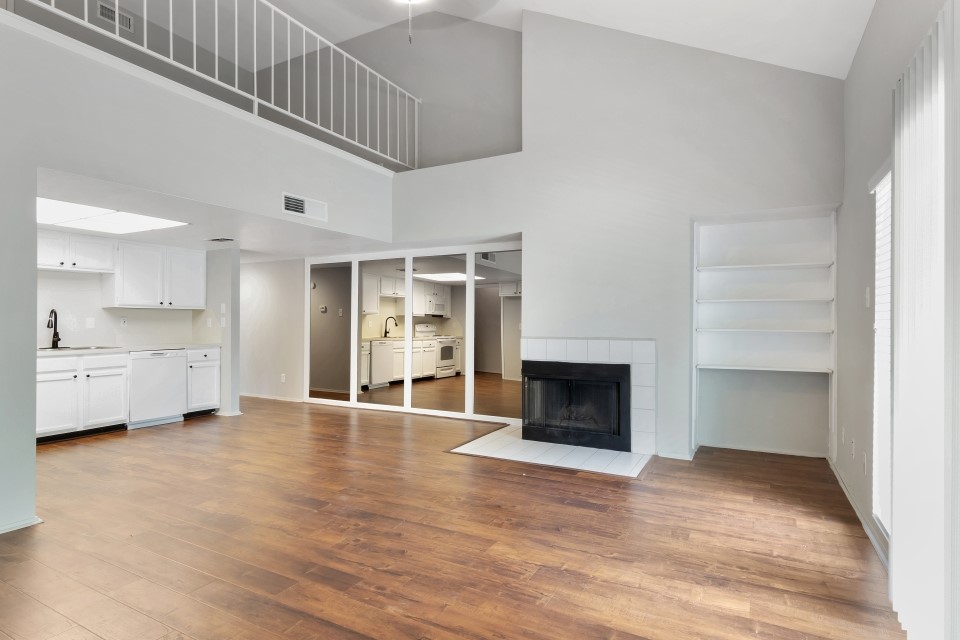 14777 Wunderlich Drive, Unit 1604 Houston, TX 77069 - Photo 14 of 19 a view of an empty room with a fireplace and a window