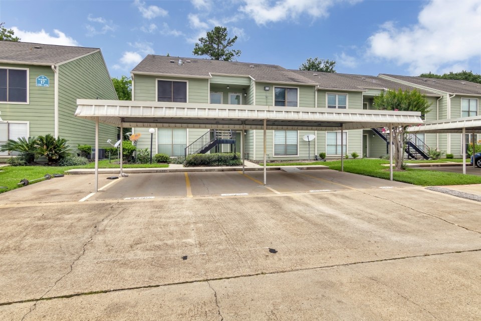 14777 Wunderlich Drive, Unit 1604 Houston, TX 77069 - Photo 19 of 19 a front view of a house with a yard