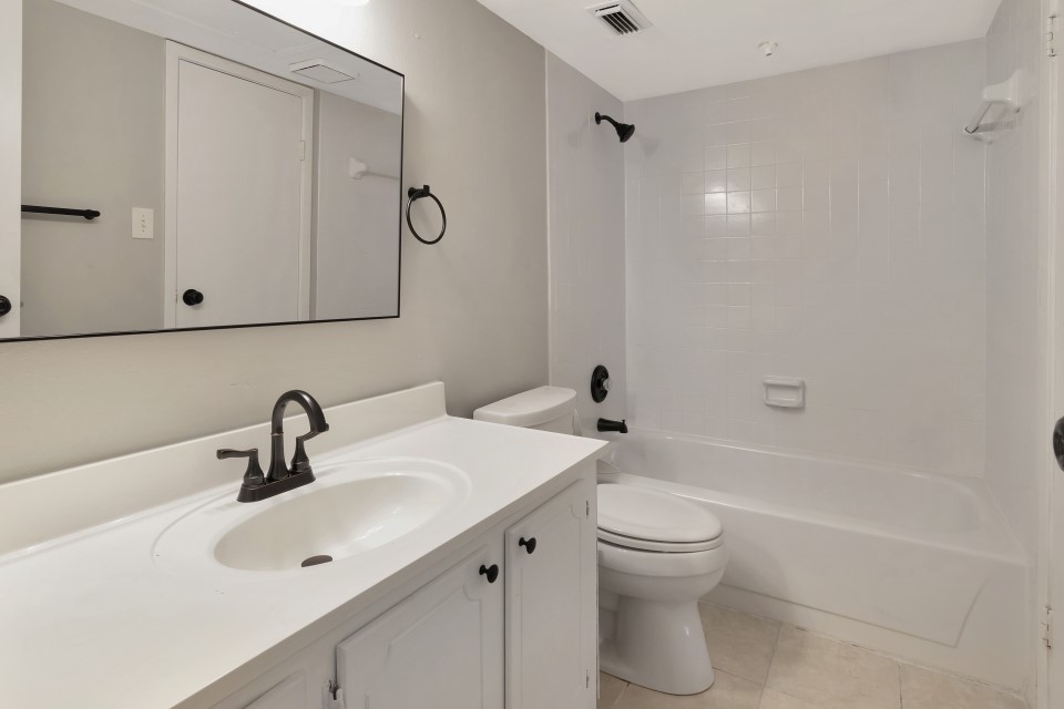 14777 Wunderlich Drive, Unit 1604 Houston, TX 77069 - Photo 8 of 19 a bathroom with a sink a toilet and shower