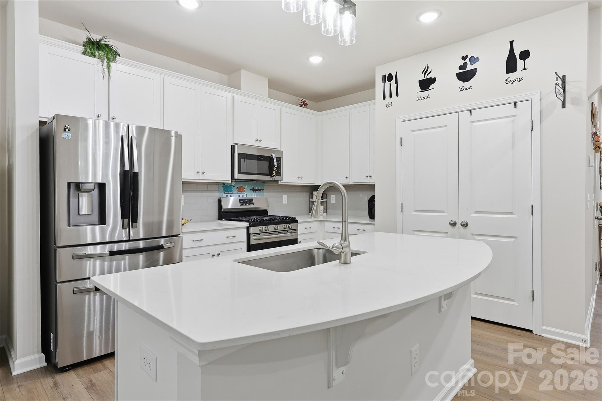 6029 Chelsea Oaks Ridge Fort Mill, SC 29708 - Photo 14 of 33 a kitchen with stainless steel appliances a refrigerator sink and microwave