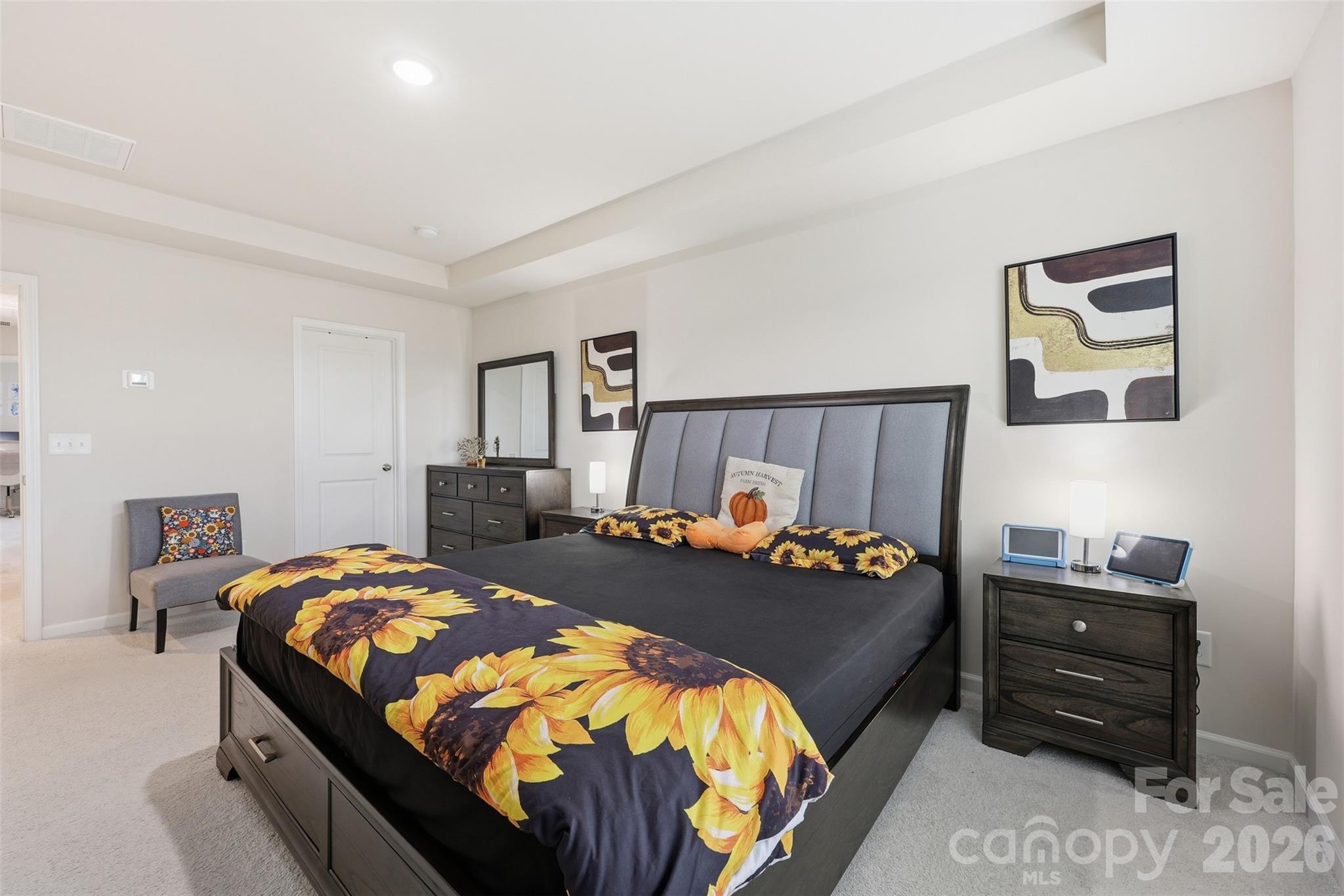 6029 Chelsea Oaks Ridge Fort Mill, SC 29708 - Photo 17 of 33 a bedroom with a bed and dresser