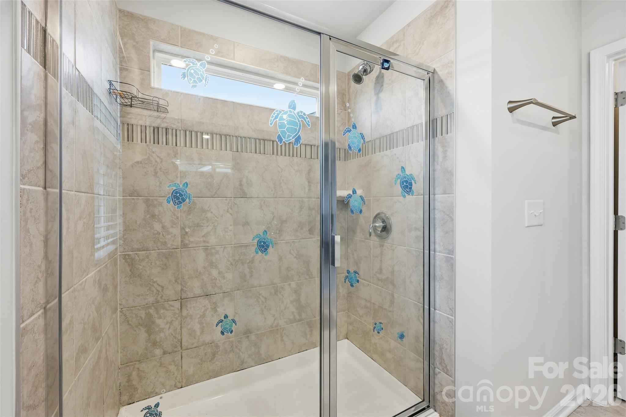 6029 Chelsea Oaks Ridge Fort Mill, SC 29708 - Photo 20 of 33 a bathroom with a glass door shower