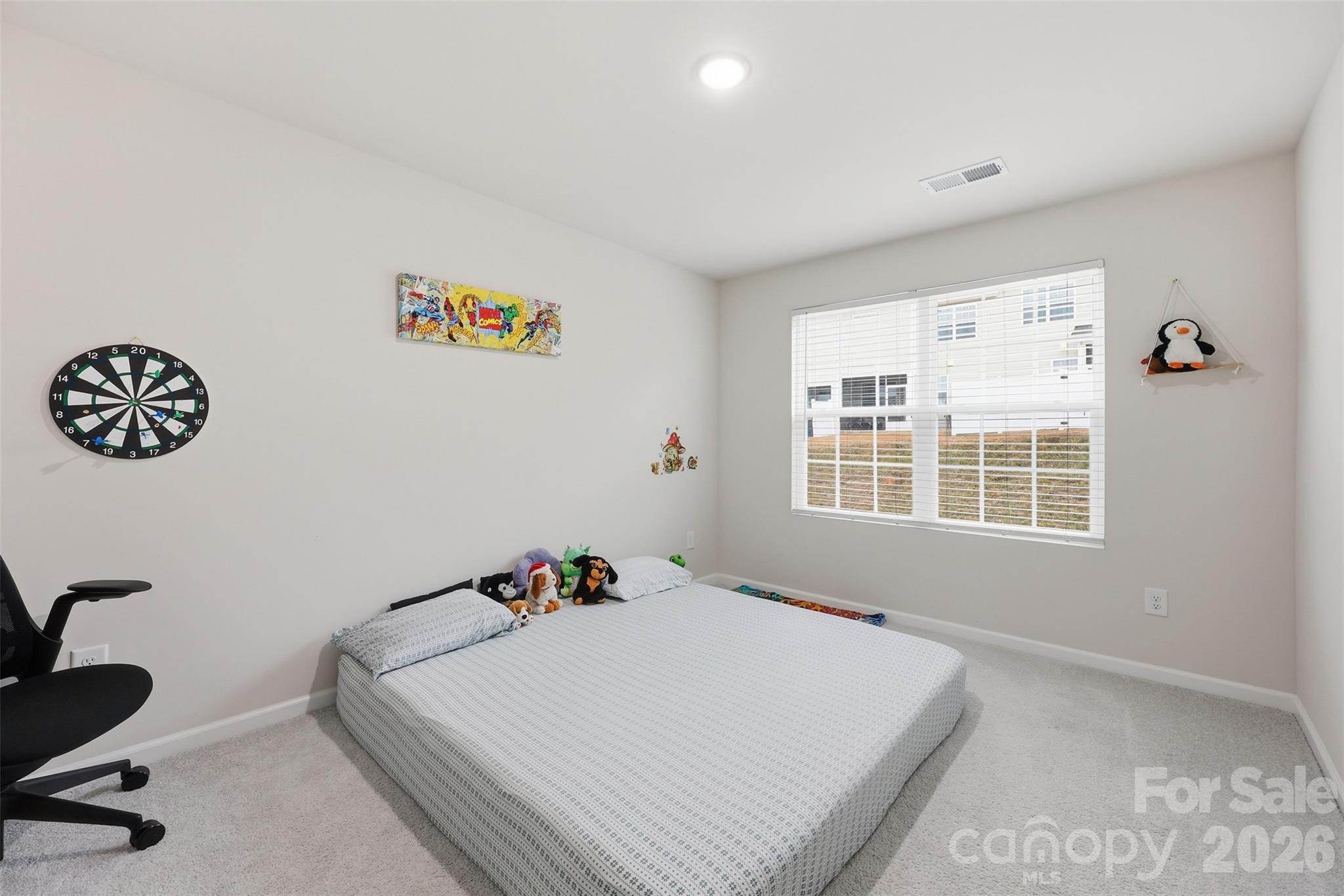 6029 Chelsea Oaks Ridge Fort Mill, SC 29708 - Photo 21 of 33 a bed room with a bed and a window