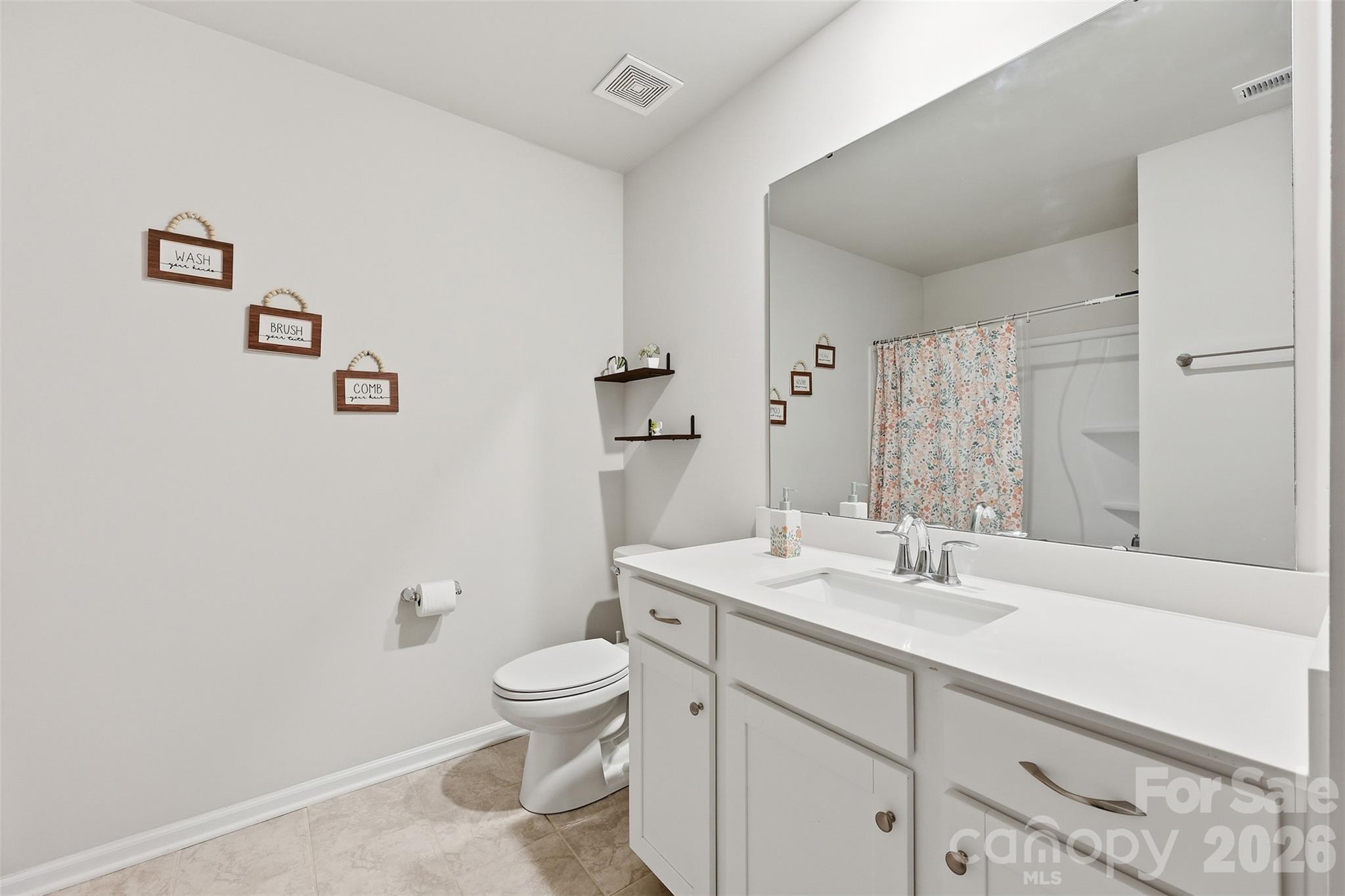 6029 Chelsea Oaks Ridge Fort Mill, SC 29708 - Photo 23 of 33 a bathroom with a sink a toilet and shower