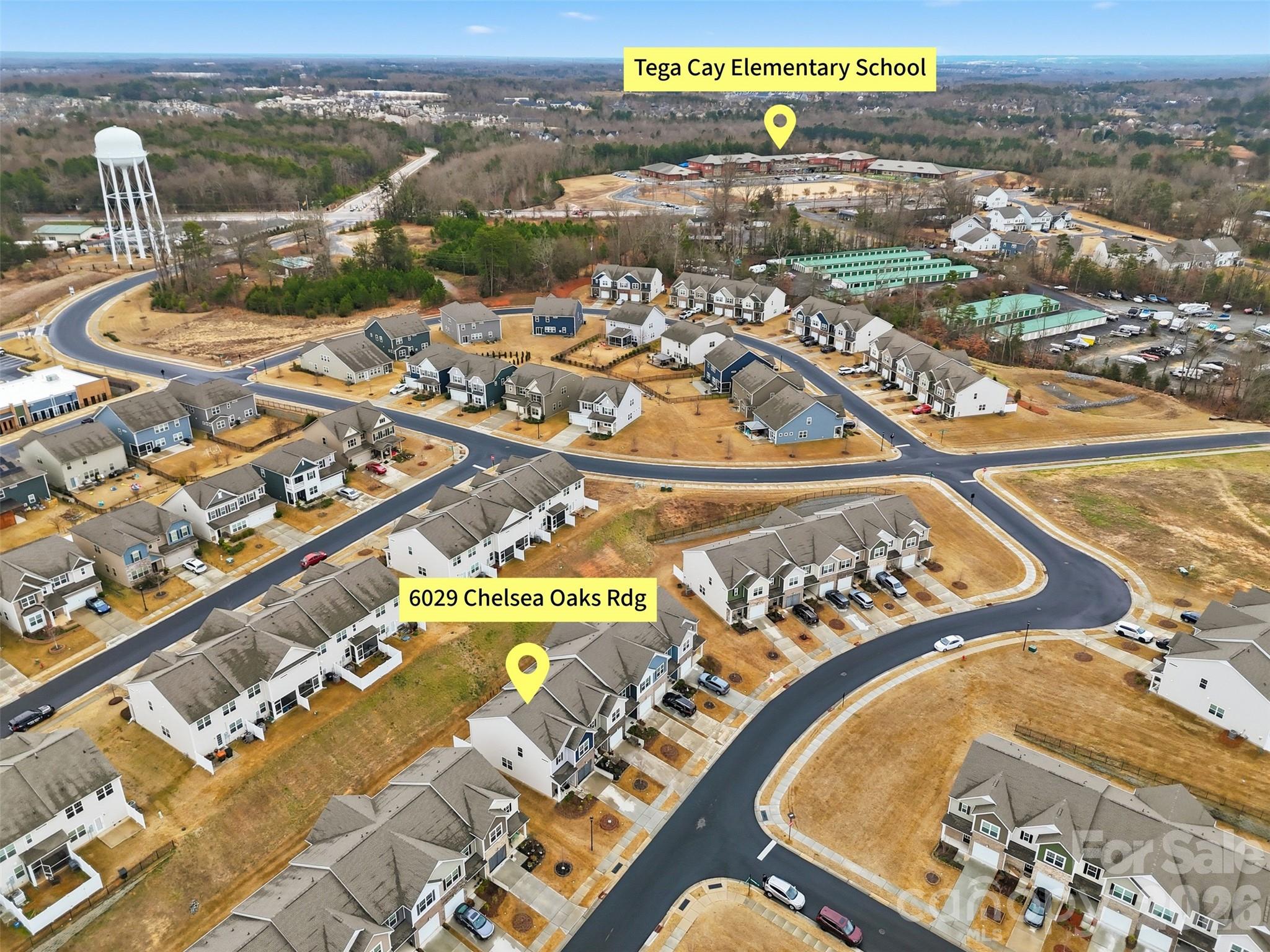 6029 Chelsea Oaks Ridge Fort Mill, SC 29708 - Photo 28 of 33 an aerial view of residential building and parking space