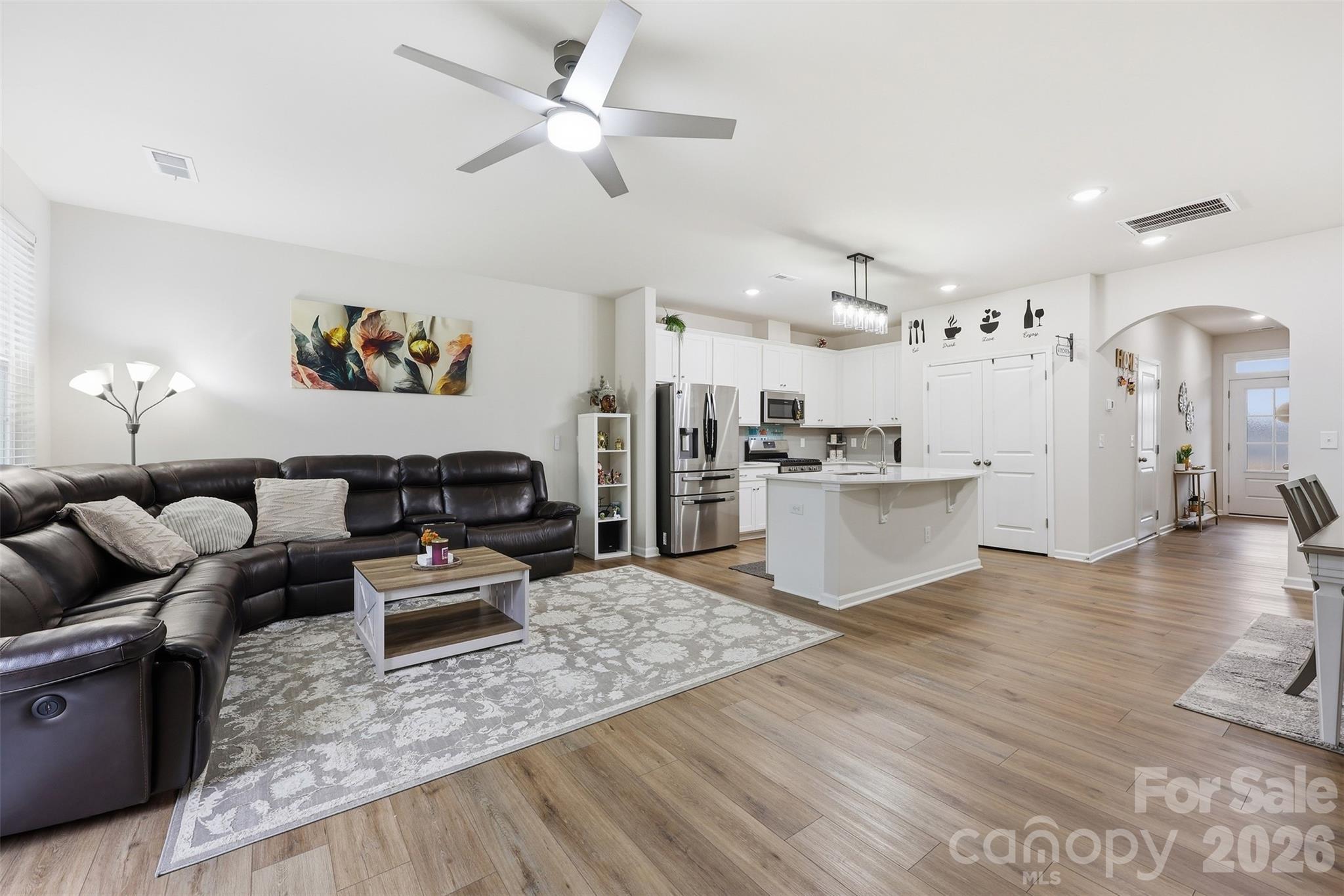 6029 Chelsea Oaks Ridge Fort Mill, SC 29708 - Photo 6 of 33 a living room with furniture and kitchen view