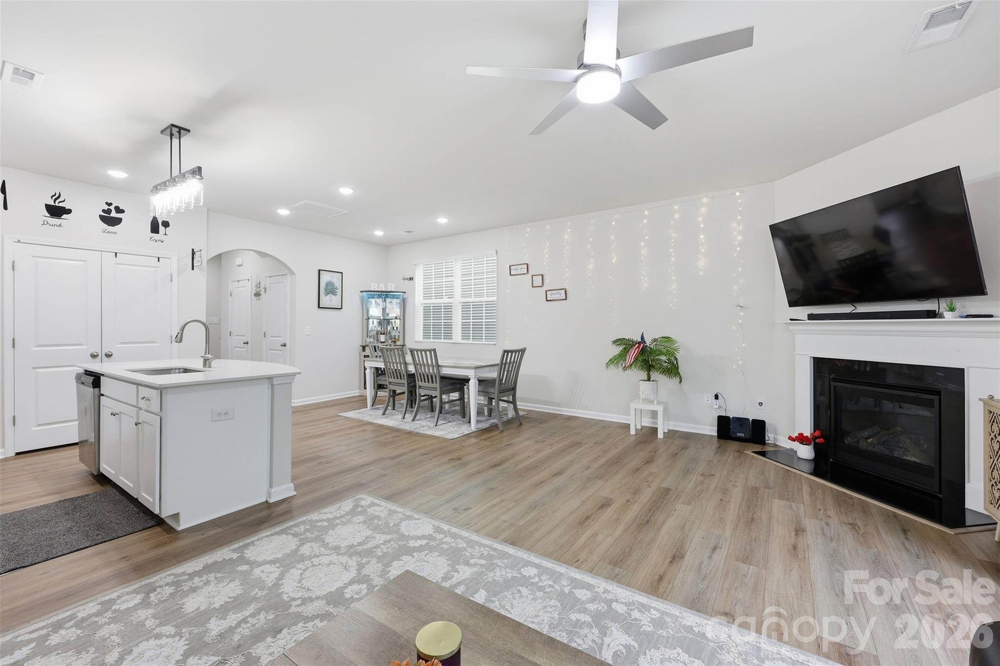 6029 Chelsea Oaks Ridge Fort Mill, SC 29708 - Photo 8 of 33 a living room with furniture a fireplace and a flat screen tv