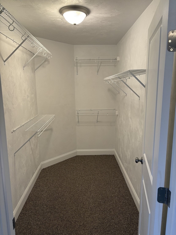 168 Main Street, Unit 1 Boylston, MA 01505 - Photo 13 of 24 a view of a room with racks on the wall