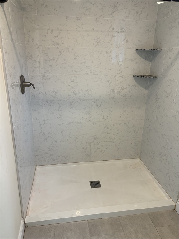 168 Main Street, Unit 1 Boylston, MA 01505 - Photo 16 of 24 a view of a bath tub sitting in a bathroom