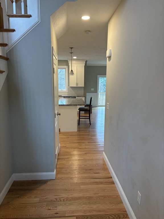 168 Main Street, Unit 1 Boylston, MA 01505 - Photo 3 of 24 a view of a kitchen from the hallway