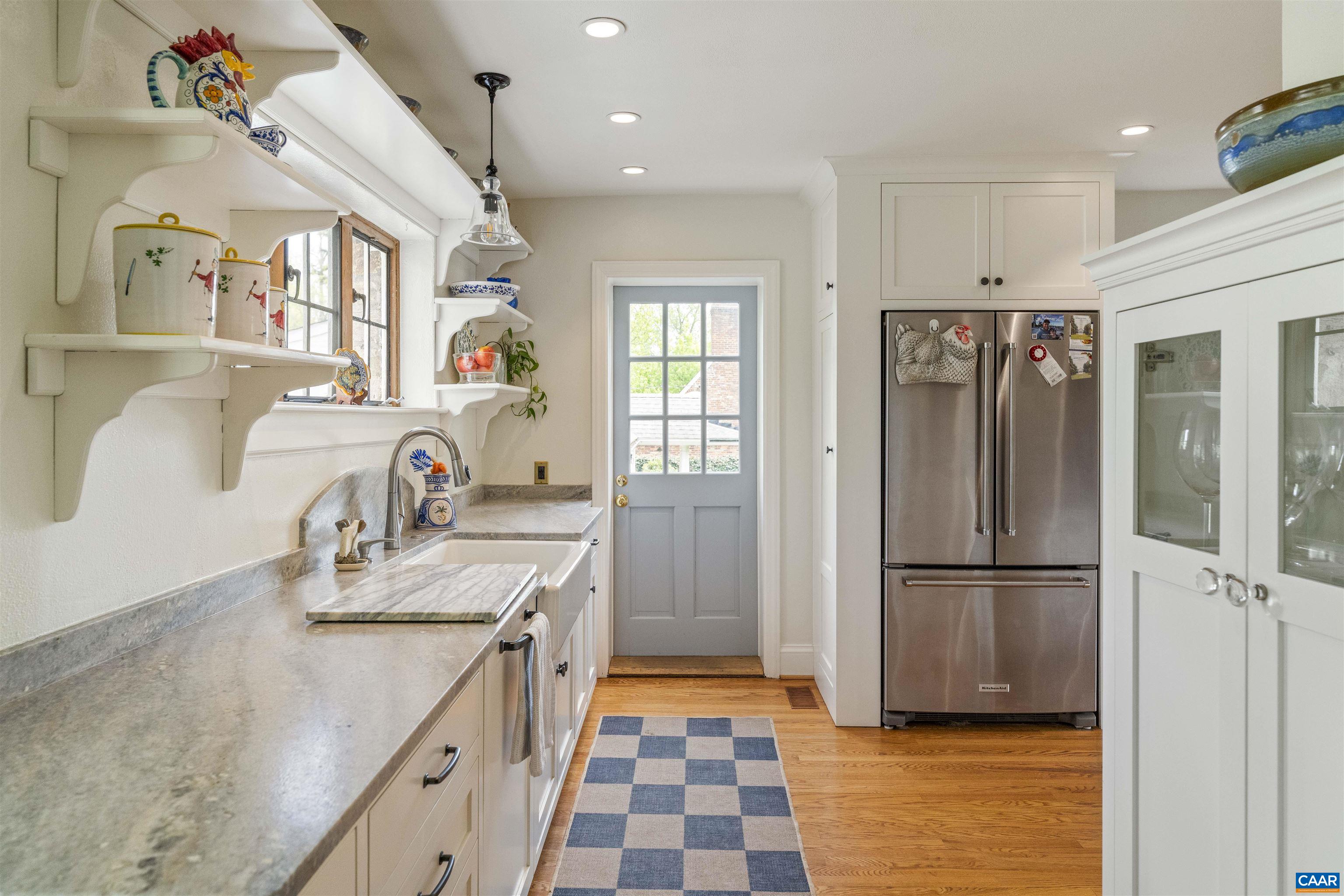 1917 Thomson Road Charlottesville, VA 22903 - Photo 13 of 45 a kitchen with stainless steel appliances granite countertop a refrigerator and a sink