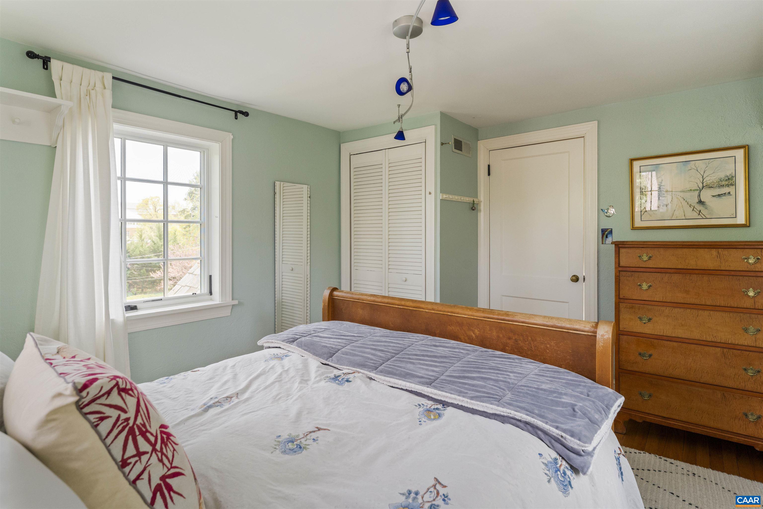 1917 Thomson Road Charlottesville, VA 22903 - Photo 30 of 45 a bedroom with a bed and a window