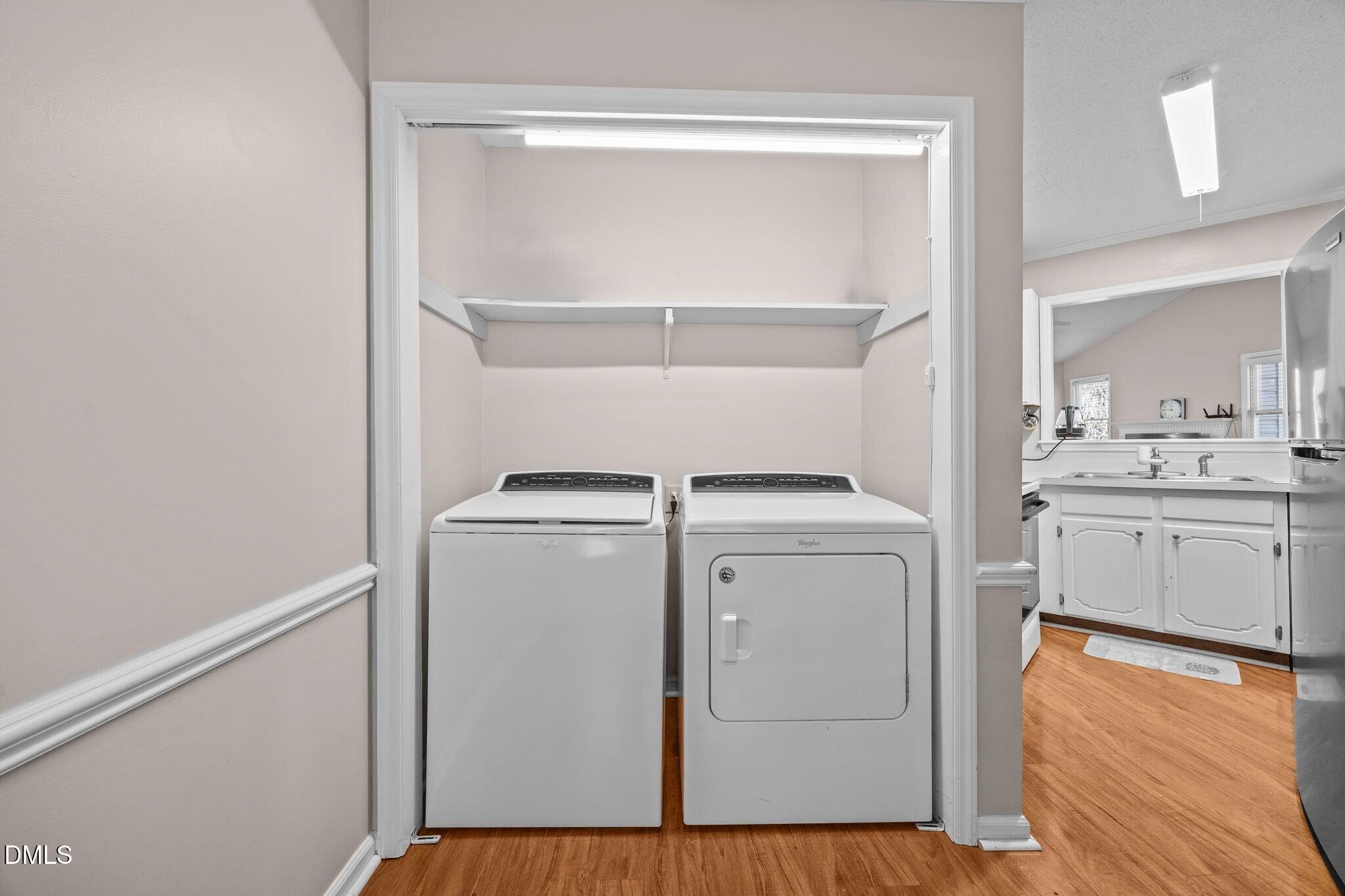 135 Boldleaf Court Cary, NC 27513 - Photo 12 of 34 a utility room with dryer and washer