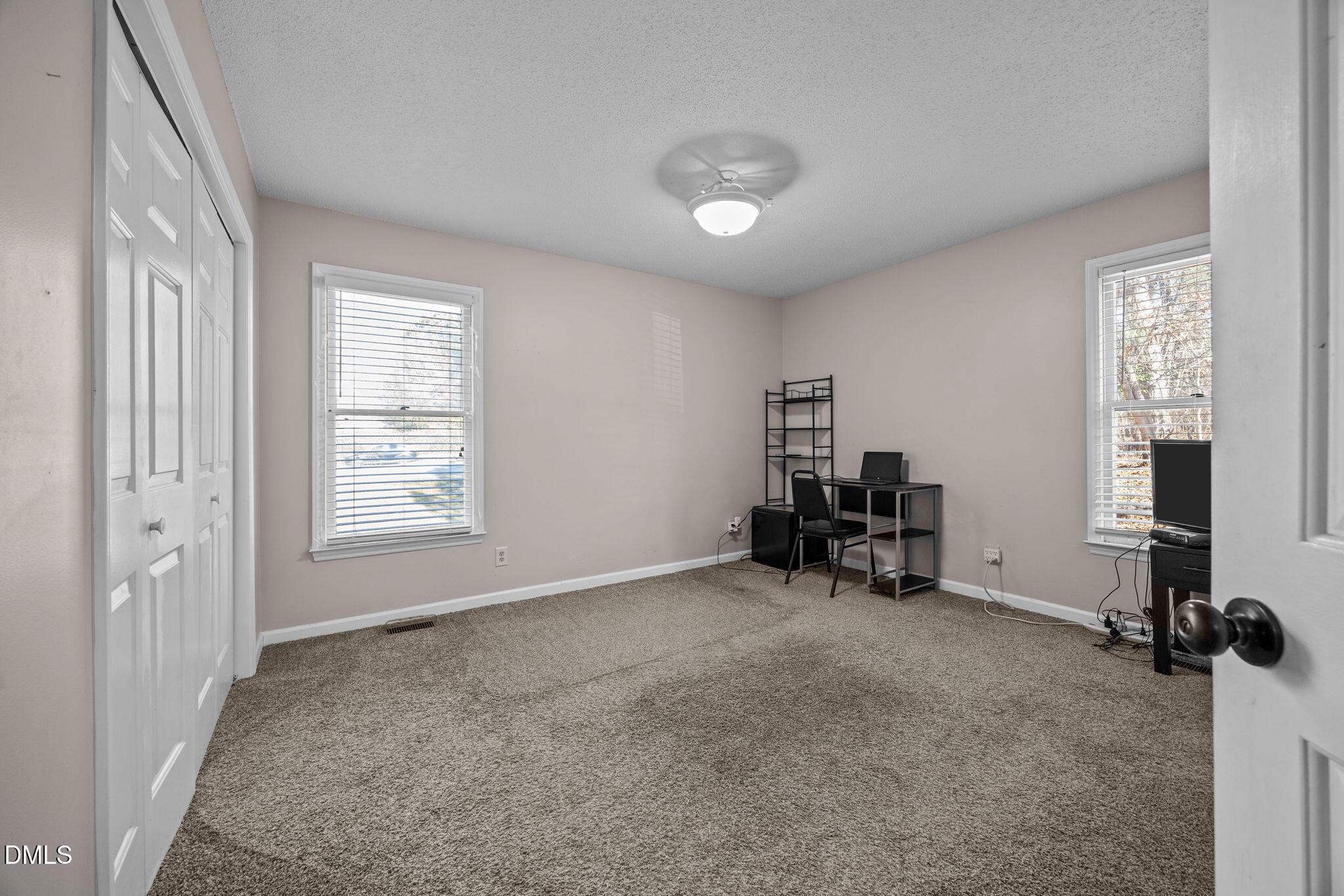 135 Boldleaf Court Cary, NC 27513 - Photo 22 of 34 a view of room with workspace and windows