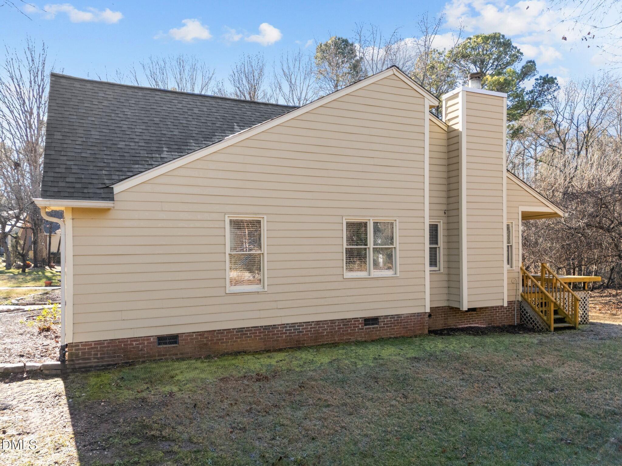135 Boldleaf Court Cary, NC 27513 - Photo 30 of 34 a view of a house with a yard