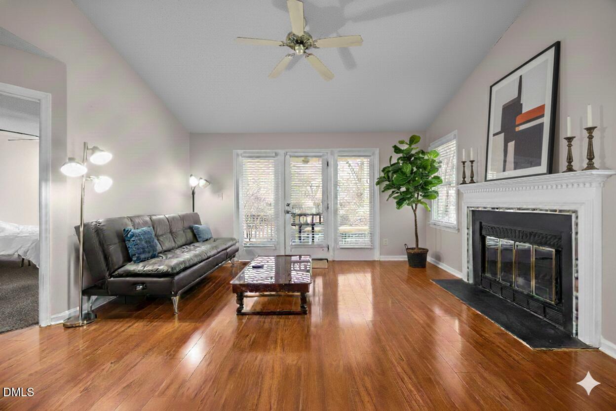 135 Boldleaf Court Cary, NC 27513 - Photo 3 of 34 a living room with furniture and a fireplace