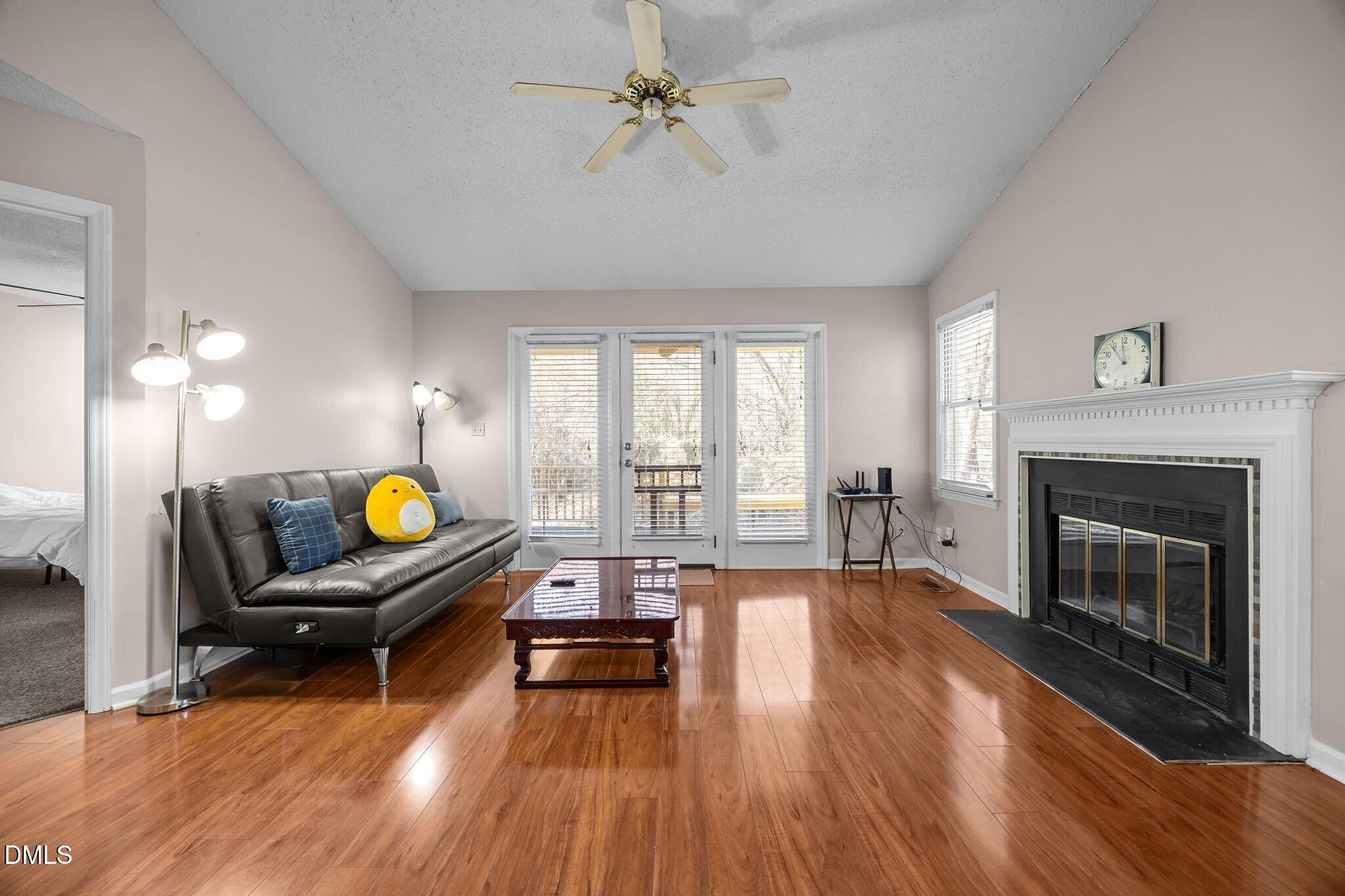 135 Boldleaf Court Cary, NC 27513 - Photo 3 of 27 a living room with furniture and a fireplace