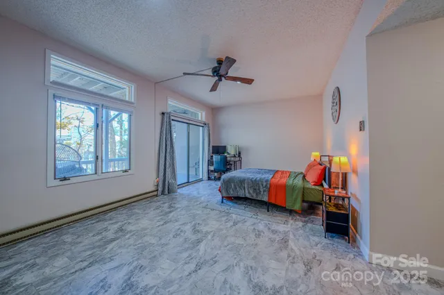 a bed room with a bed and a window