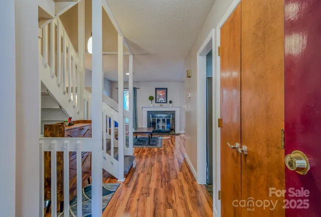 a view of living room with wooden floor