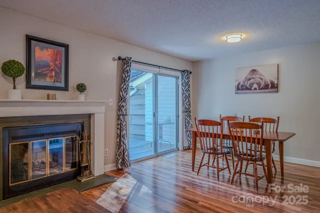 a view of a livingroom with furniture and a fireplace
