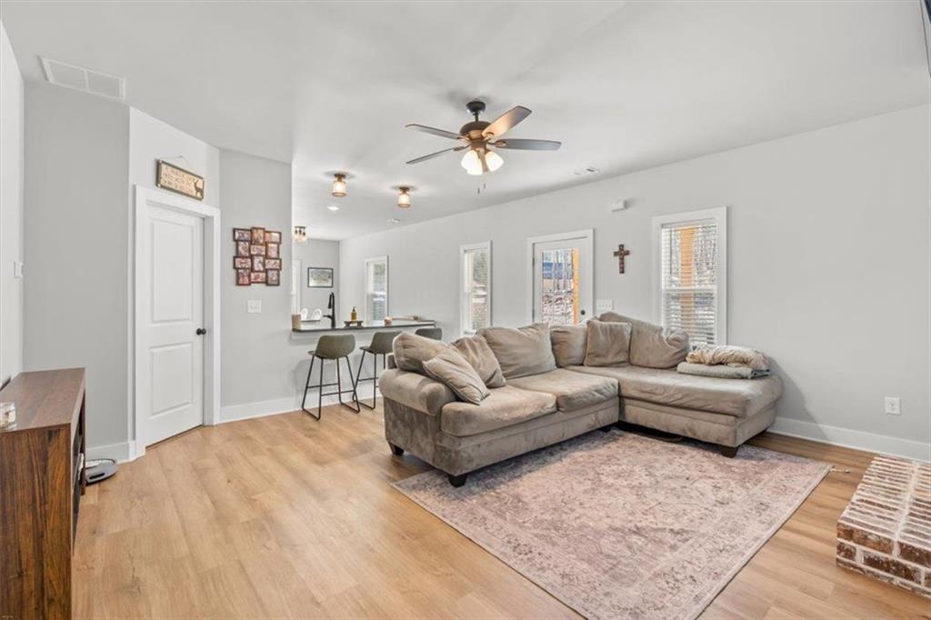 2522 Honeysuckle Lane Temple, GA 30179 - Photo 12 of 43 a living room with furniture and a chandelier