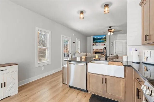 a kitchen with a sink stove and cabinets