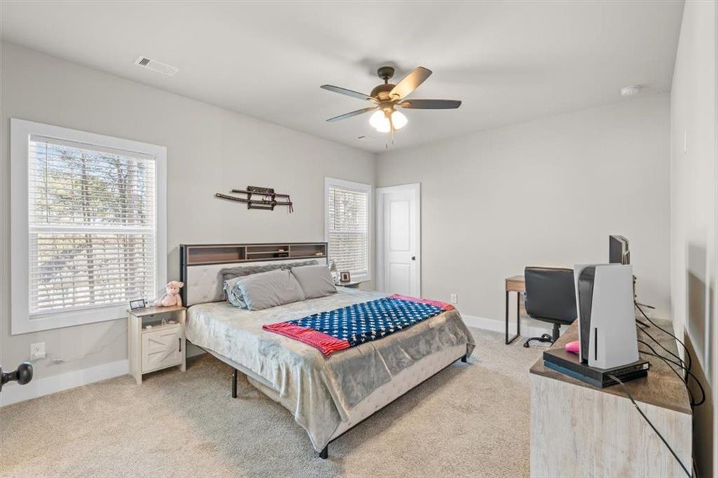 2522 Honeysuckle Lane Temple, GA 30179 - Photo 20 of 43 a bedroom with a bed and a window