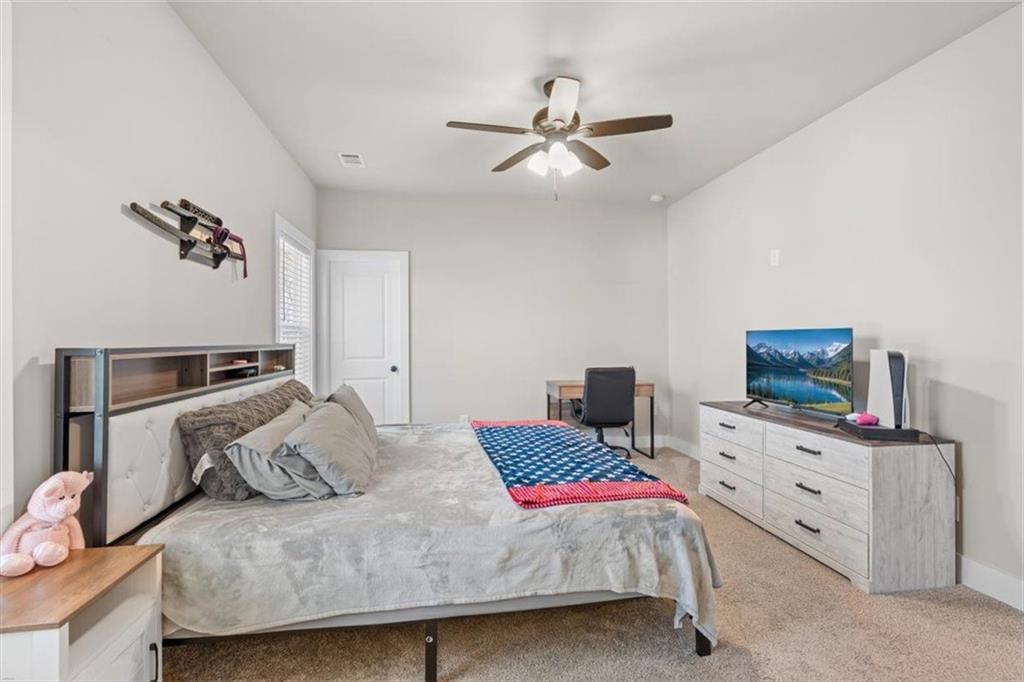 2522 Honeysuckle Lane Temple, GA 30179 - Photo 22 of 43 a bedroom with a bed and dresser