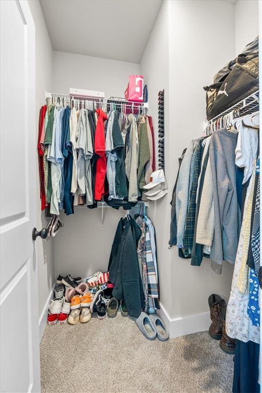2522 Honeysuckle Lane Temple, GA 30179 - Photo 23 of 43 a view of walk in closet with clothes