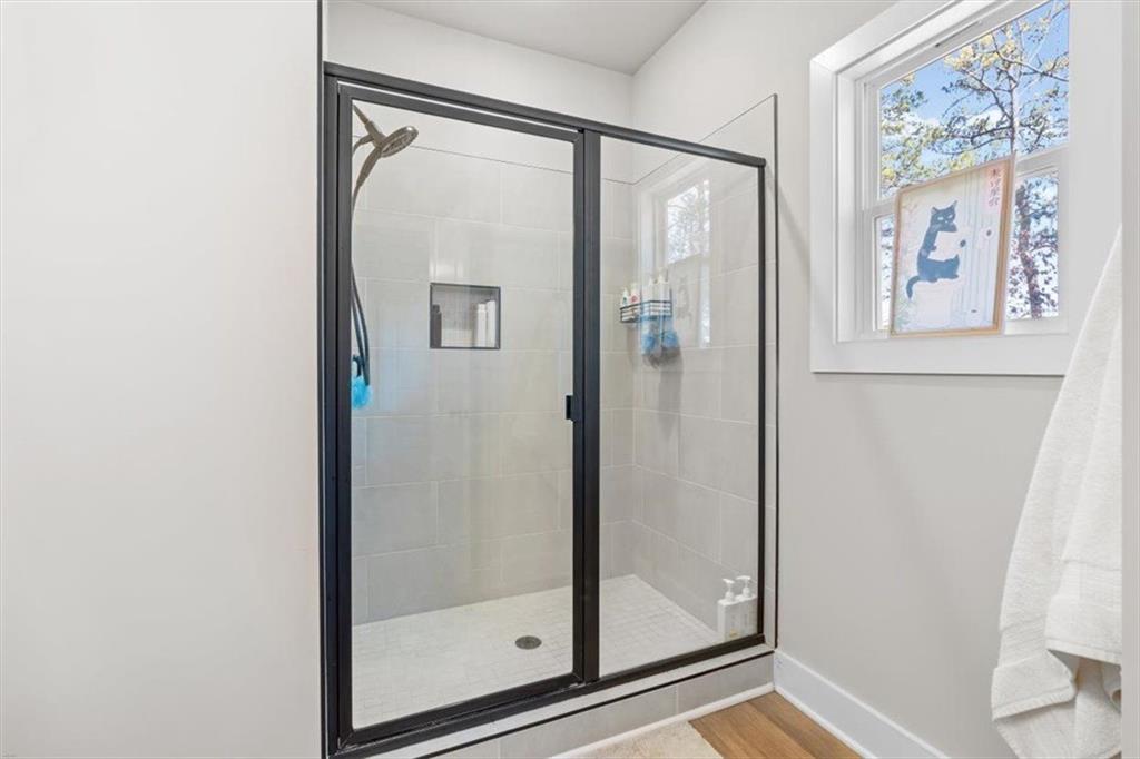 2522 Honeysuckle Lane Temple, GA 30179 - Photo 25 of 43 a bathroom with a glass shower door