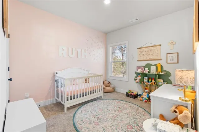 a bedroom with furniture and a window