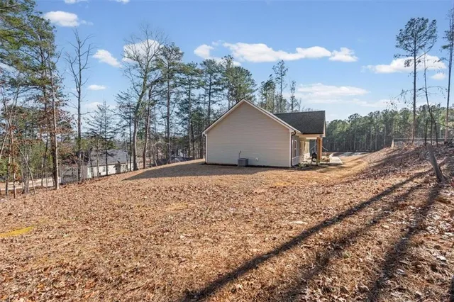 a view of a backyard of the house