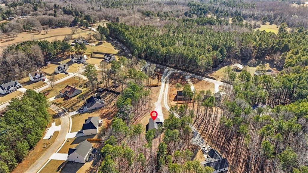 2522 Honeysuckle Lane Temple, GA 30179 - Photo 41 of 43 an aerial view of multi story residential apartment building with parking space