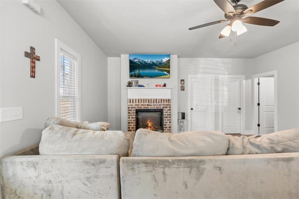 2522 Honeysuckle Lane Temple, GA 30179 - Photo 10 of 43 a living room with furniture and a fireplace