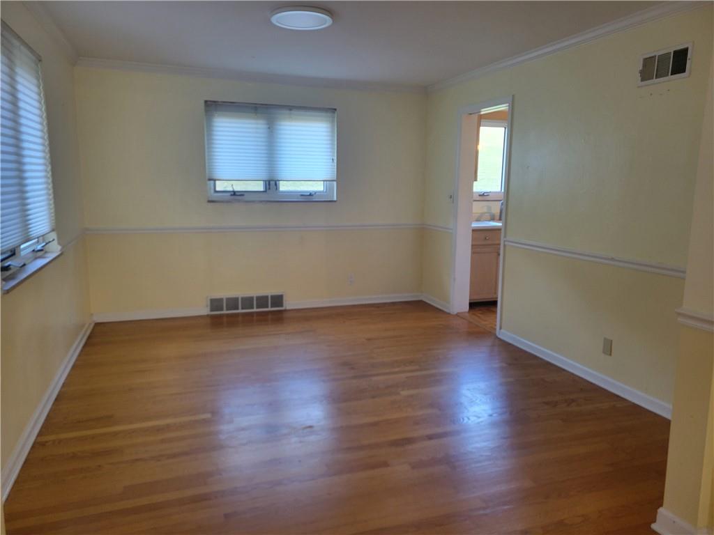 1260 Fox Chapel Road Pittsburgh, PA 15238 - Photo 16 of 29 an empty room with wooden floor and windows