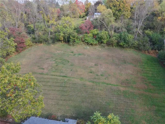 a view of a pathway both side of a house