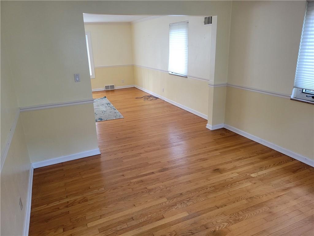 1260 Fox Chapel Road Pittsburgh, PA 15238 - Photo 20 of 29 an empty room with wooden floor and windows