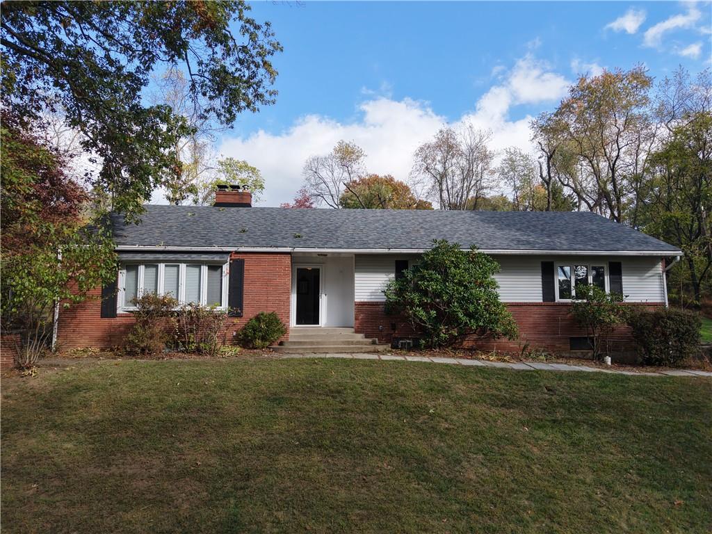 1260 Fox Chapel Road Pittsburgh, PA 15238 - Photo 2 of 29 a front view of a house with a yard