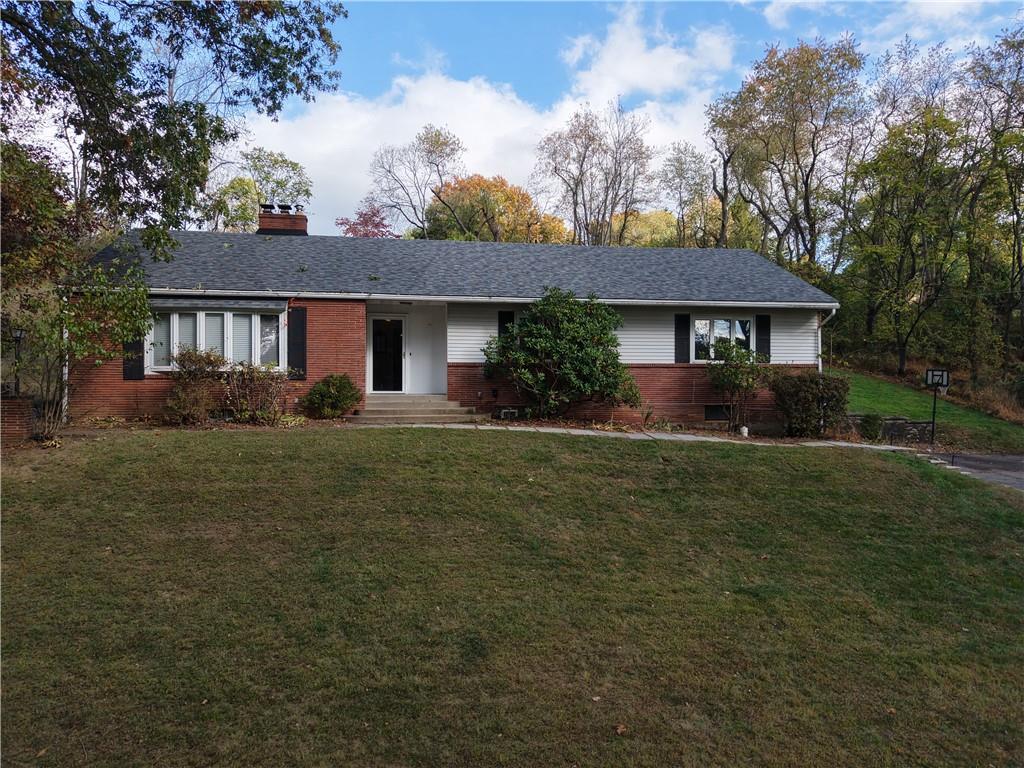 1260 Fox Chapel Road Pittsburgh, PA 15238 - Photo 22 of 29 front view of a house with a yard