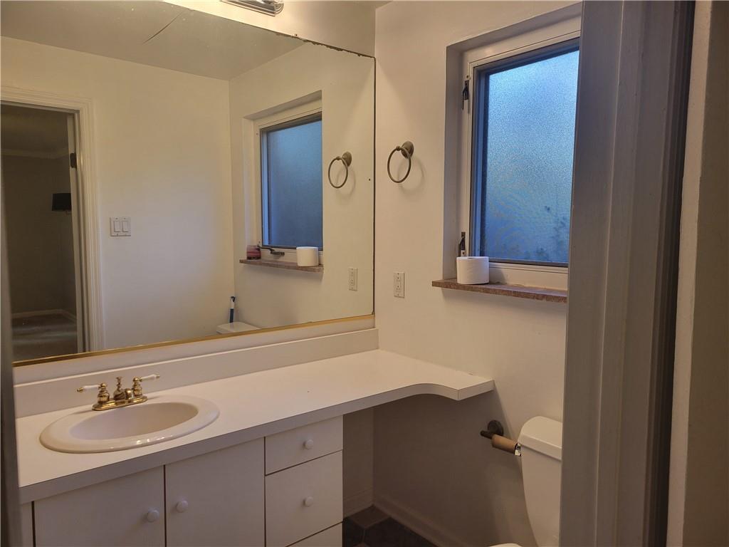 1260 Fox Chapel Road Pittsburgh, PA 15238 - Photo 27 of 29 a bathroom with a sink and a mirror