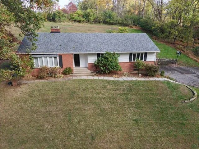 front view of a house with a yard