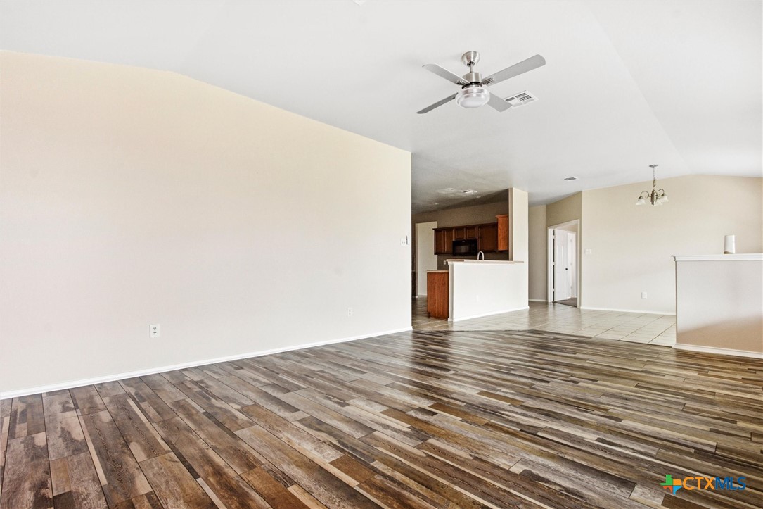 200 Memory Lane Harker Heights, TX 76548 - Photo 13 of 27 a view of a livingroom with wooden floor and a ceiling fan