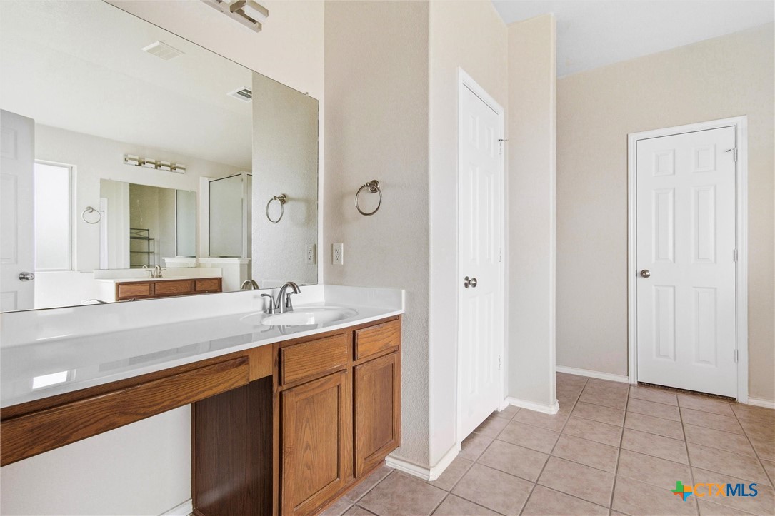 200 Memory Lane Harker Heights, TX 76548 - Photo 17 of 27 a bathroom with a sink a mirror and a shower