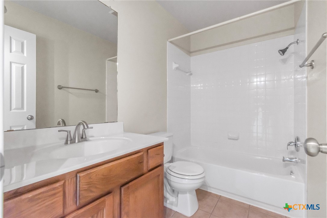 200 Memory Lane Harker Heights, TX 76548 - Photo 23 of 27 a bathroom with a granite countertop sink a toilet and shower
