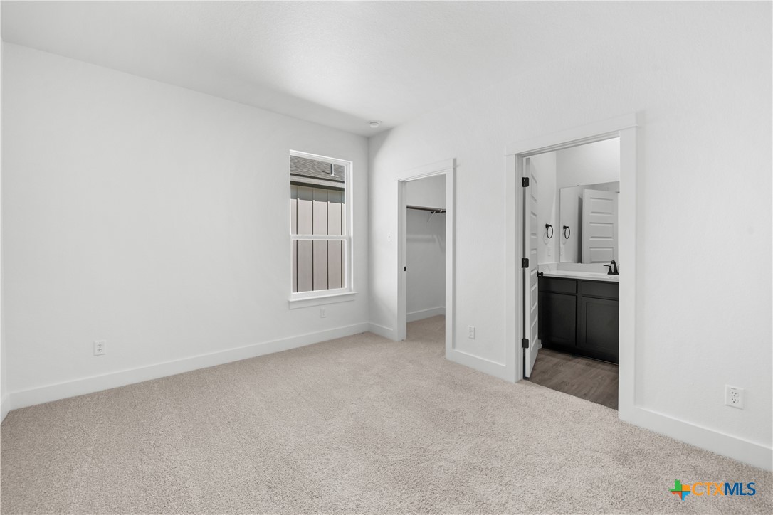 1807 Bear Grass Rdg Road Temple, TX 76501 - Photo 12 of 16 an empty room with windows