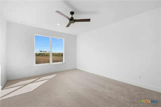 a kitchen with stove and wooden floor