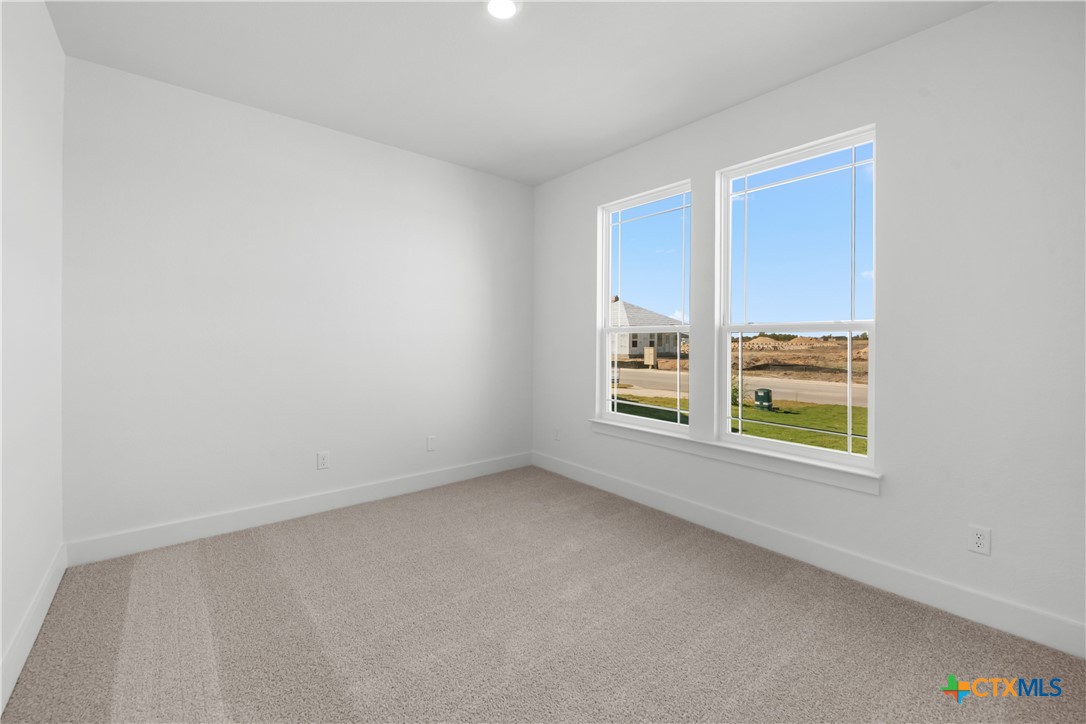 1807 Bear Grass Rdg Road Temple, TX 76501 - Photo 9 of 16 an empty room with windows